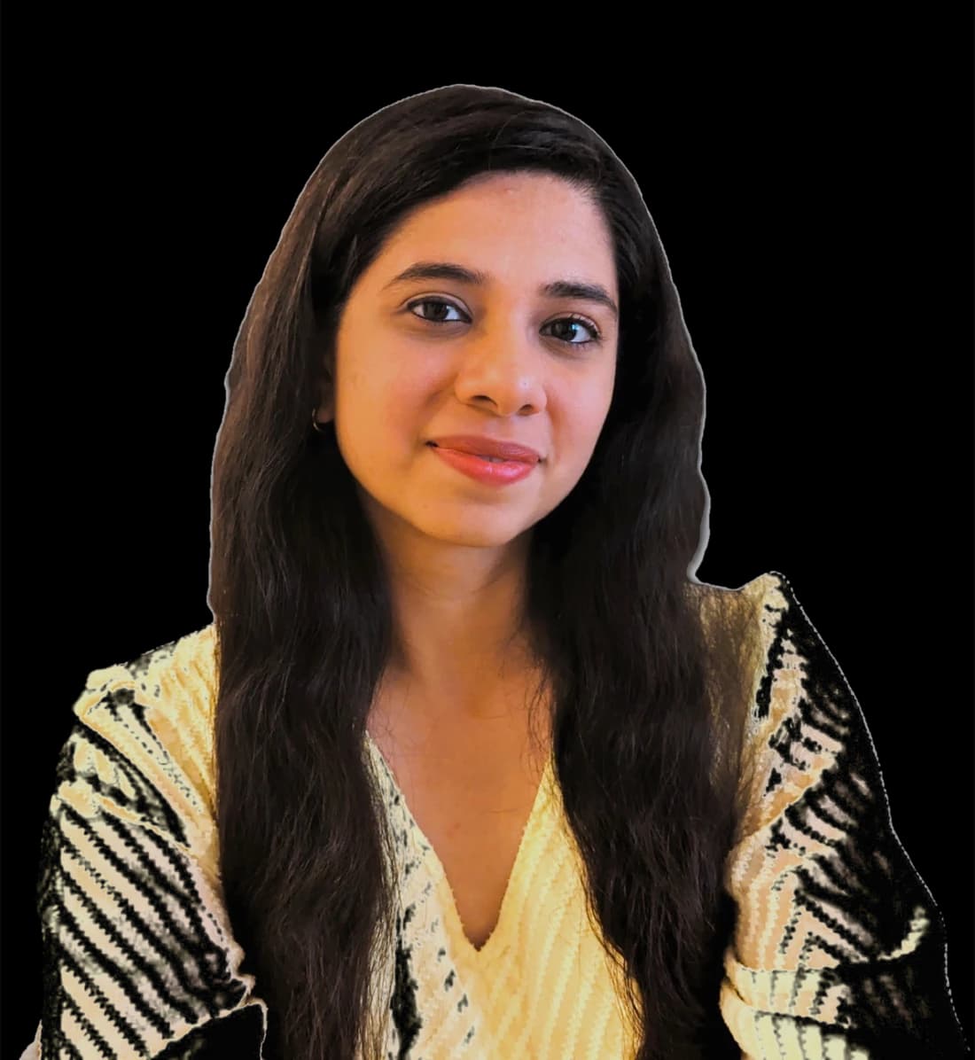 Anjana Iyer, Registered Psychotherapist, smiling in a cream patterned top.